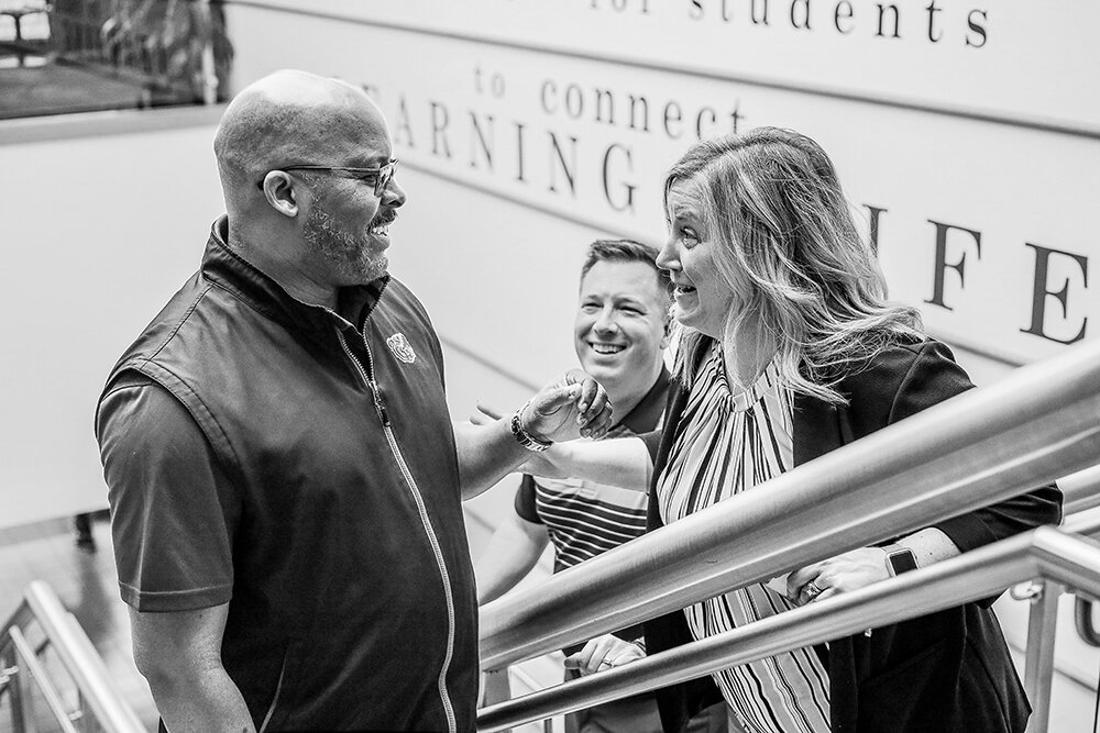 CATCHING UP: Hart stops on the way to lunch to chat with Plaster Student Union Director Terry Weber and MSU Dean of Students Andrea Weber.